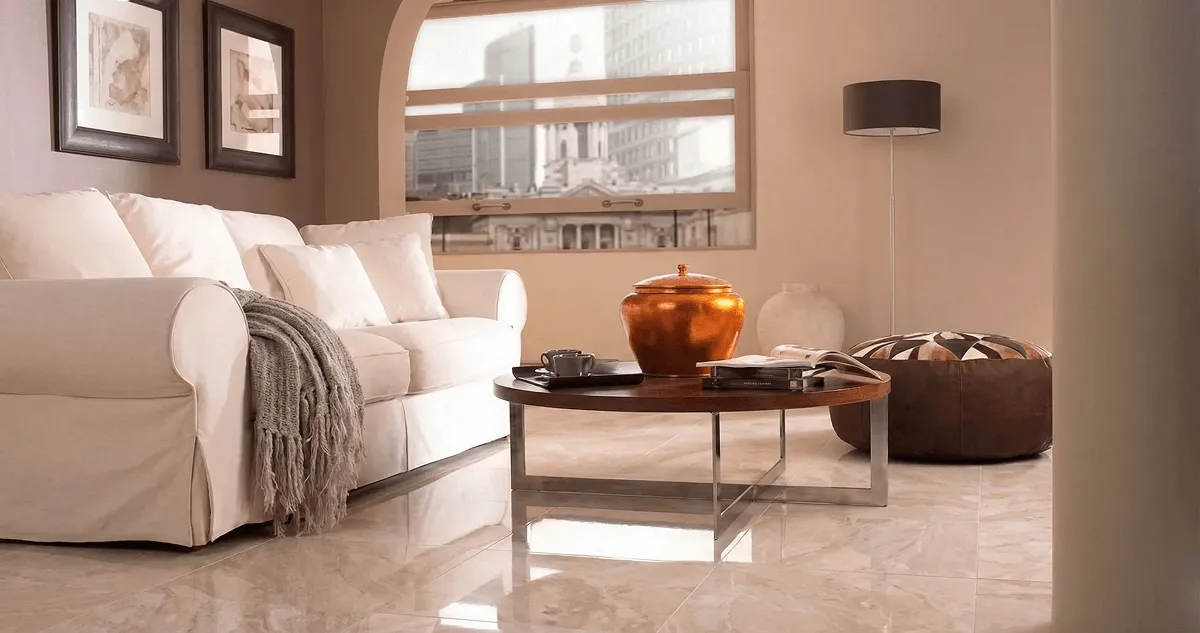 Modern living room with professionally installed marble flooring, a beige sofa, coffee table in Green Bay, WI
