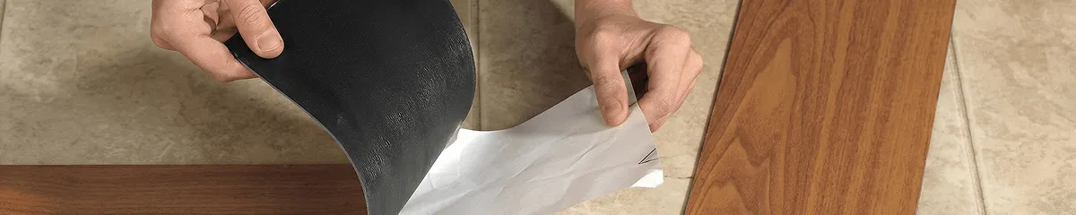 A professional installing vinyl flooring in Green Bay, WI